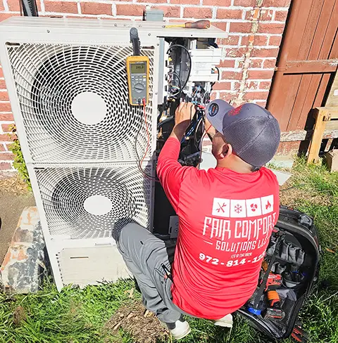 Fair Comfort Solutions technician working to repair a customer's ductless air conditioner